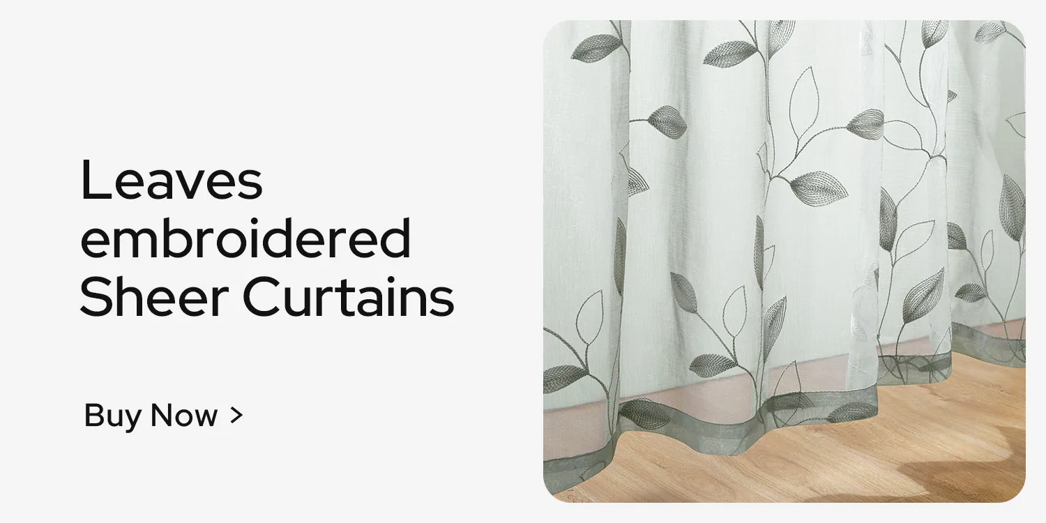 Leaf-embroidered sheer fabric, close enough to read the stitch